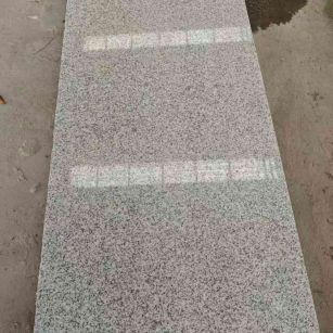 鹤岗芝麻白光面毛板